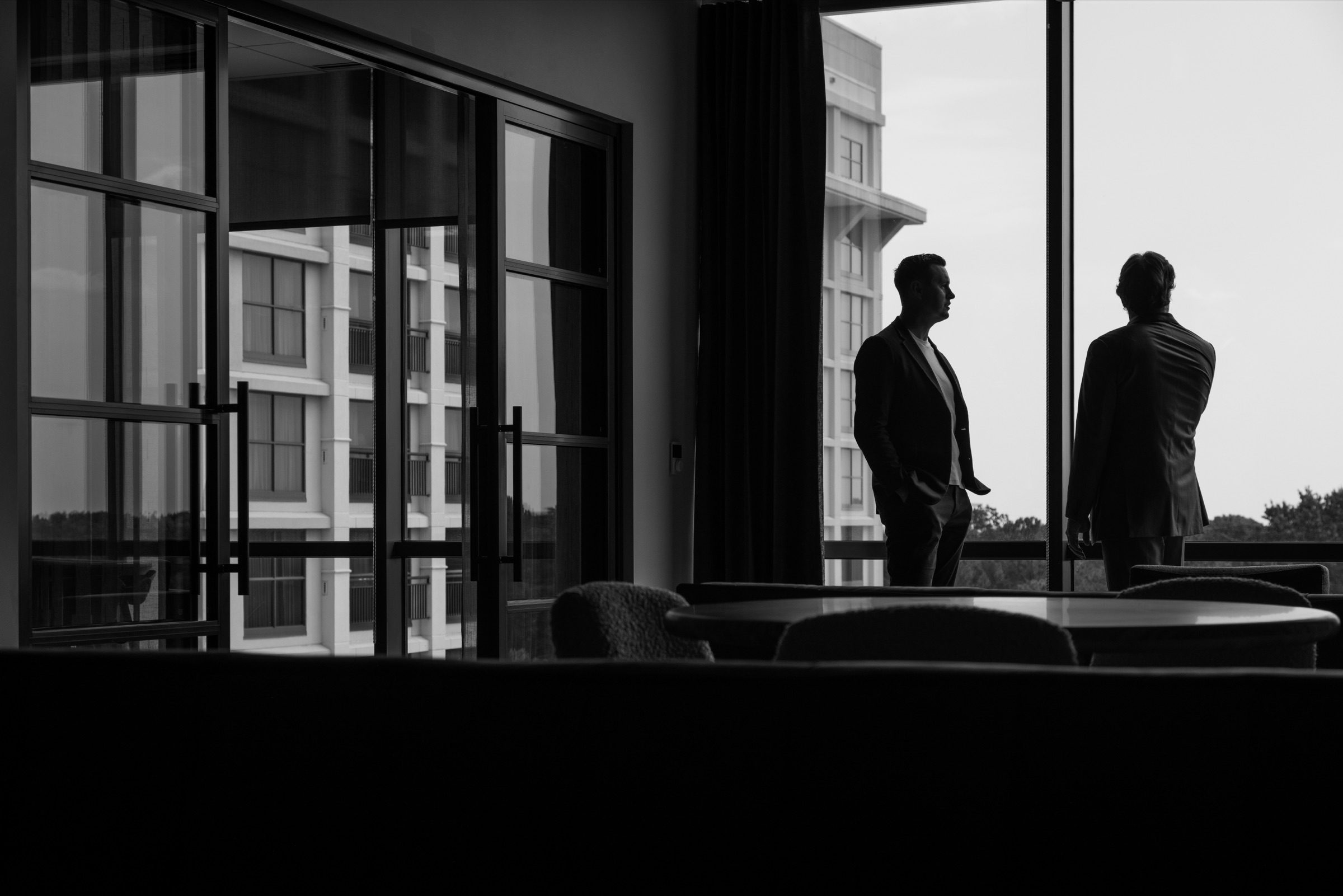 Bonner and David at a window overlooking the city