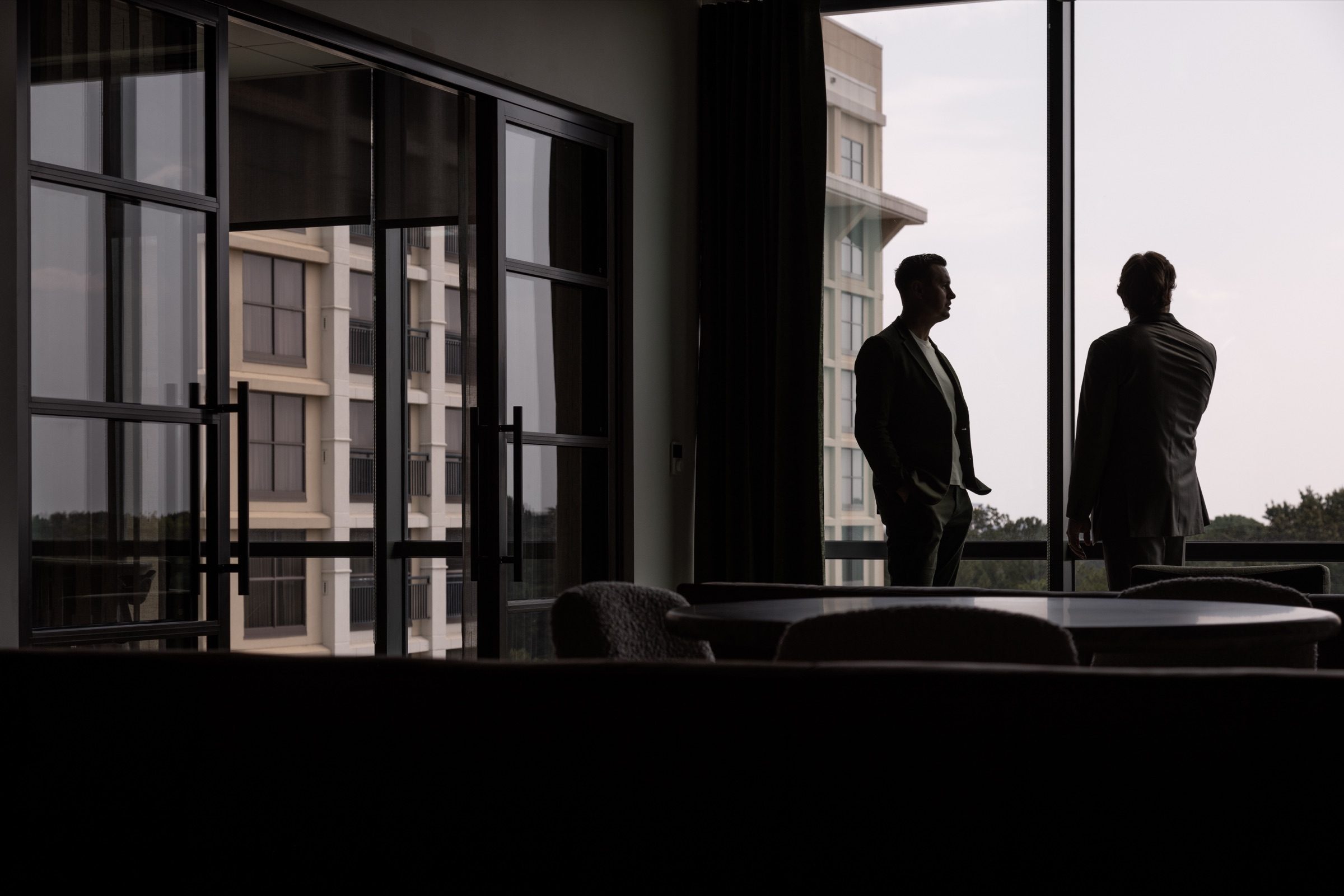 Bonner and David at a window overlooking the city